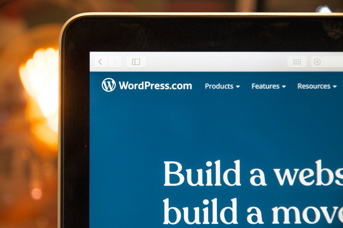 Close-up of a laptop screen showing the WordPress.com 'Build a website' homepage