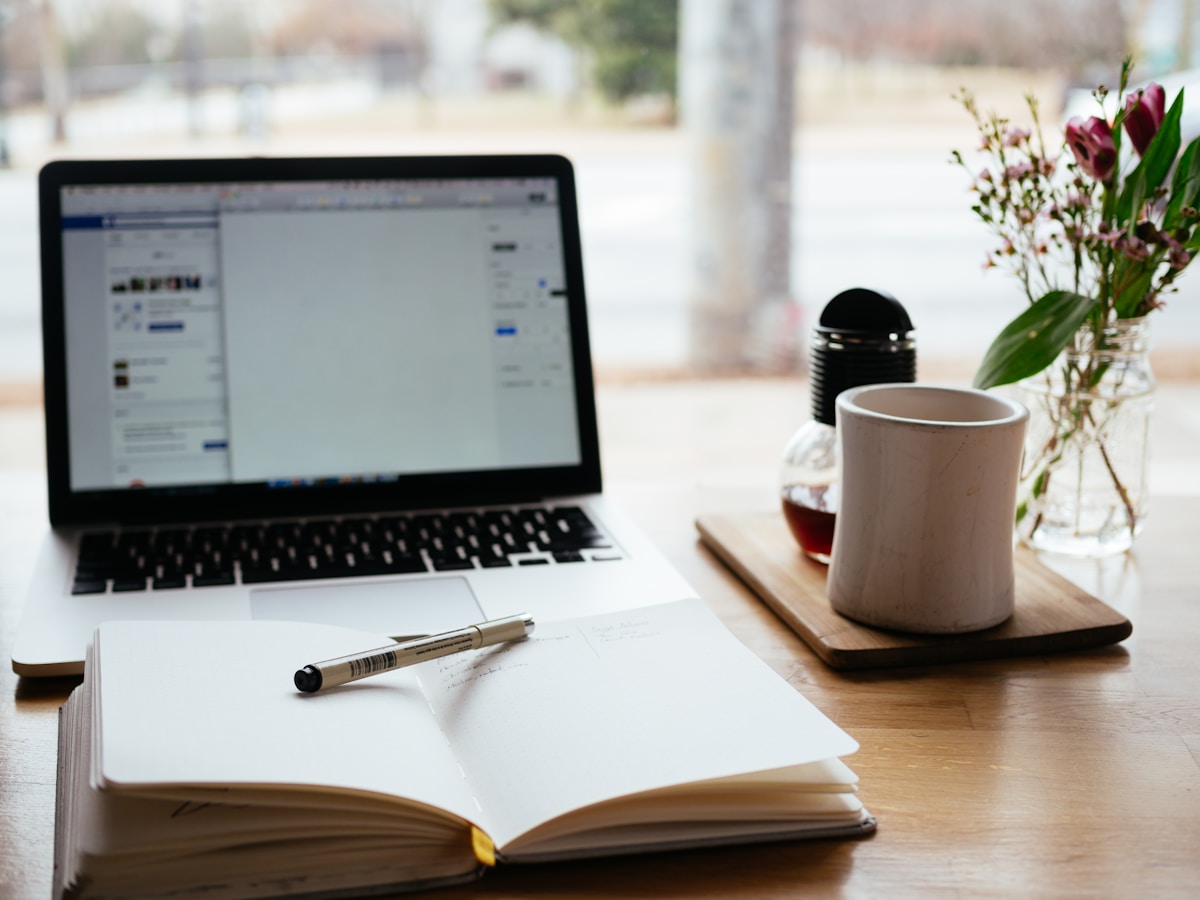 Laptop and coffee on a clean desk