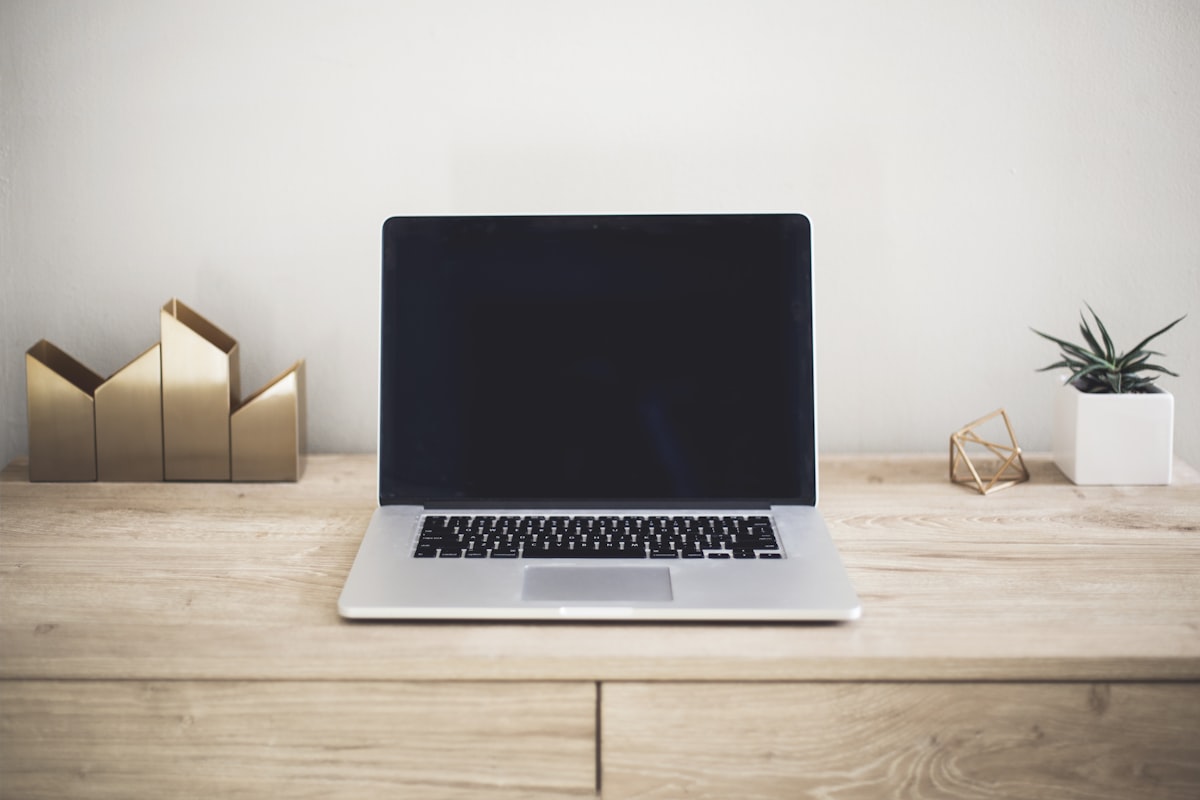 Laptop on a desk, representing a business owner's own website