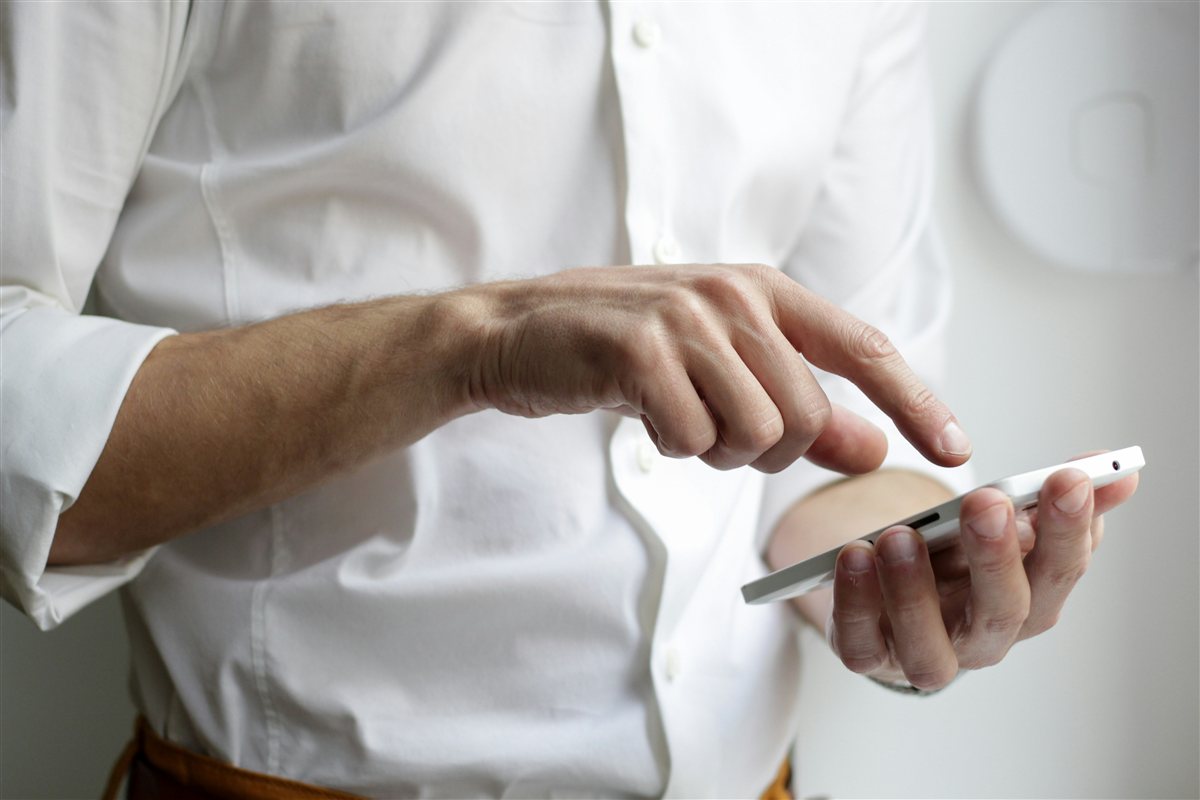 Person comfortably browsing a website on a phone